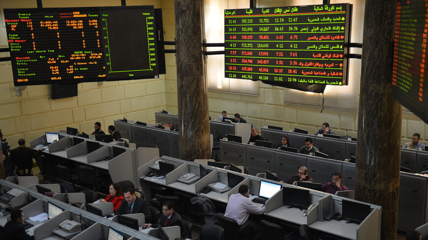 Stock market brokers work at the Egyptian Exchange, Cairo, Egypt, Jan. 6, 2013.