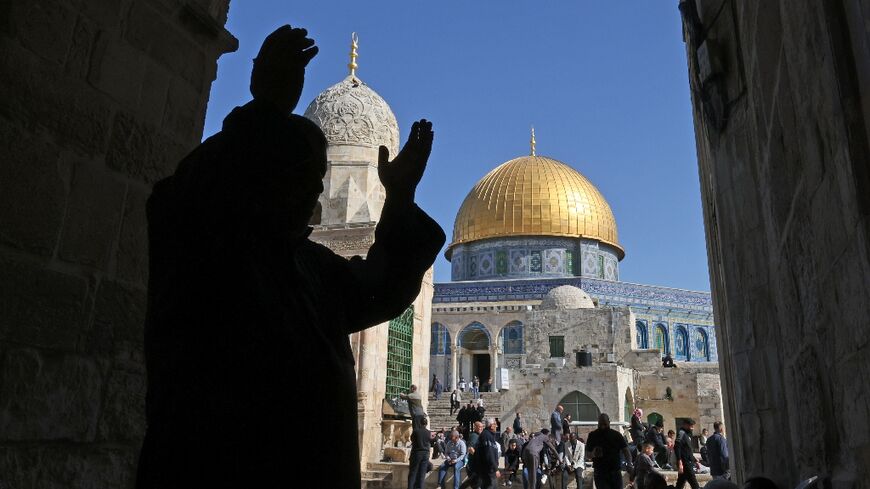 Palestinians gather in the Al-Aqsa mosques compound before the Friday noon prayer in Jerusalem on January 27, 2023