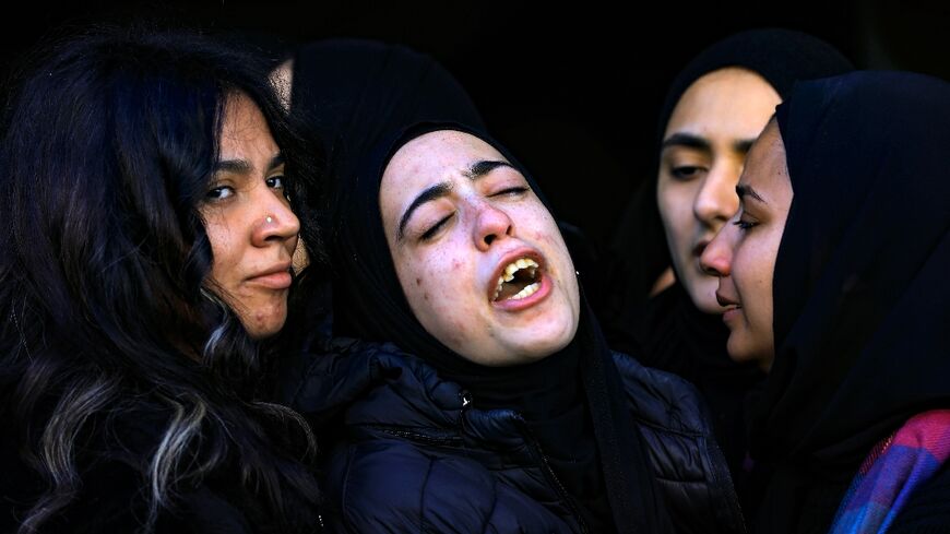 The daughter of Jawad Farid Bawaqna, killed on Thursday, cries during his funeral in the Jenin refugee camp in the West Bank 