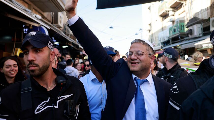 Itamar Ben Gvir, Israel's new Minister of National Security and leader of the far-right Otzma Yehudit (Jewish Power) party, greets supporters during a visit to Jerusalem's Mahane Yehuda market on Dec. 30, 2022.