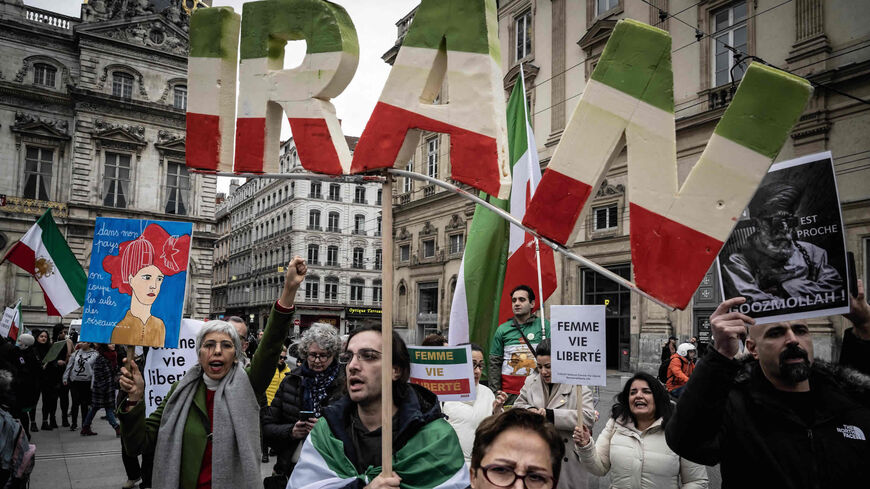 Protesters take part in a rally against the Iranian regime, marking the third anniversary of the downing of Ukrainian passenger jet, flight PS752, by Iranian forces shortly after its takeoff from Tehran and to pay tribute to Mohammad Moradi, an Iranian student who committed suicide by drowning himself in the Rhone River in December 2022 to draw attention to the situation in Iran, Lyon, France, Jan. 8, 2023.