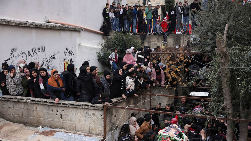 Mourners attend the funeral of Omar Khmour, 14, in the Dheisheh refugee camp, Bethlehem, West Bank, Jan. 16, 2023.