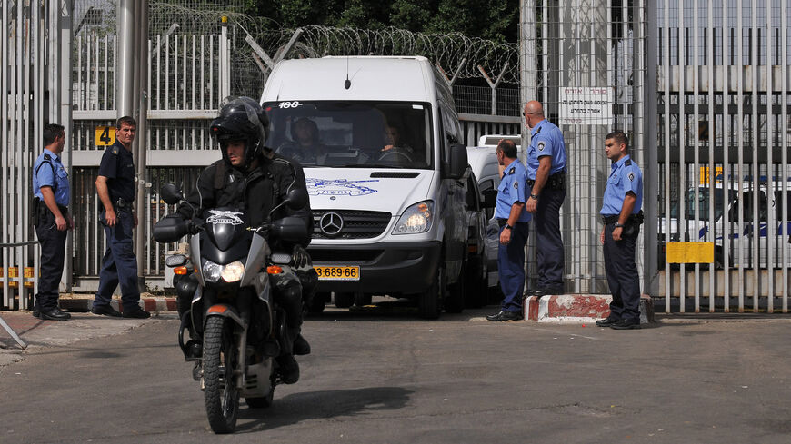 Israeli police vans carrying 19 Palestinian women leave Hadarim prison, near the coastal city of Netanya, Israel, Oct. 2, 2009.