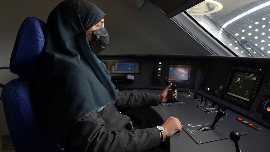 Driver Raneem Azzouz takes her seat at the helm of a high-speed train ferrying pilgrims to Mecca, less than five years after Saudi authorities gave women the right to drive road vehicles