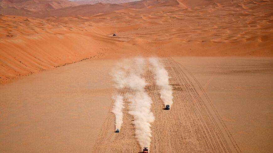 Sand stars: Cristiano Batista (left), Martin Macik and David Svanda race through the Empty Quarter