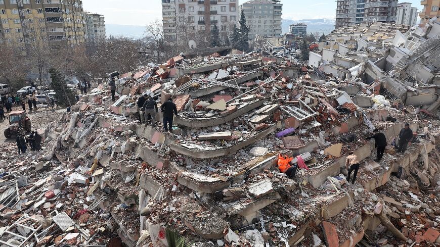 Civilians look for survivors under the rubble of collapsed buildings in Kahramanmaras, close to the quake's epicentre