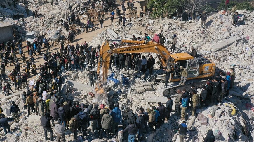 Rescuers search amid the ruins in Syria's rebel-held northwestern Idlib province on February 8, 2023 