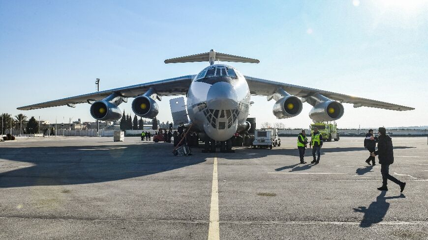 Aid parcels for earthquake victims are unloaded from a Saudi aircraft in Syria's second city Aleppo, the first flight from the kingdom since Riyadh broke off relations more than a decade ago