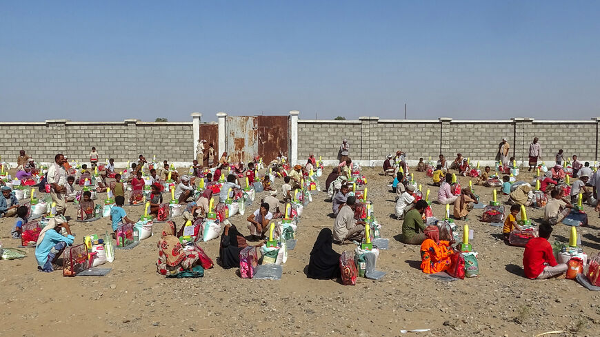 People displaced by conflict receive food aid and provisions to meet their basic needs.