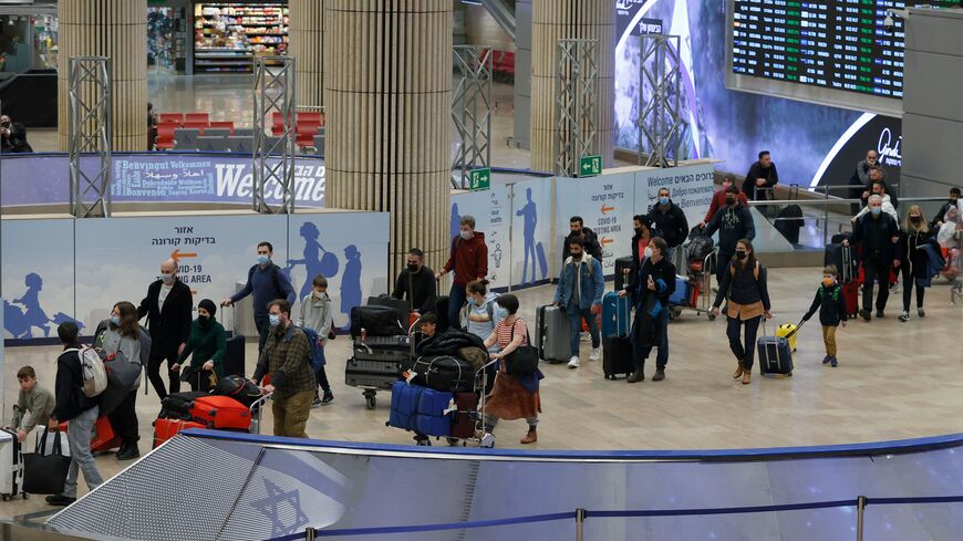 Passengers arrive at Israel's Ben Gurion airport in Lod on March 1, 2022. A US visa waiver will energize travel between the two countries. (Photo by JACK GUEZ/AFP via Getty Images)