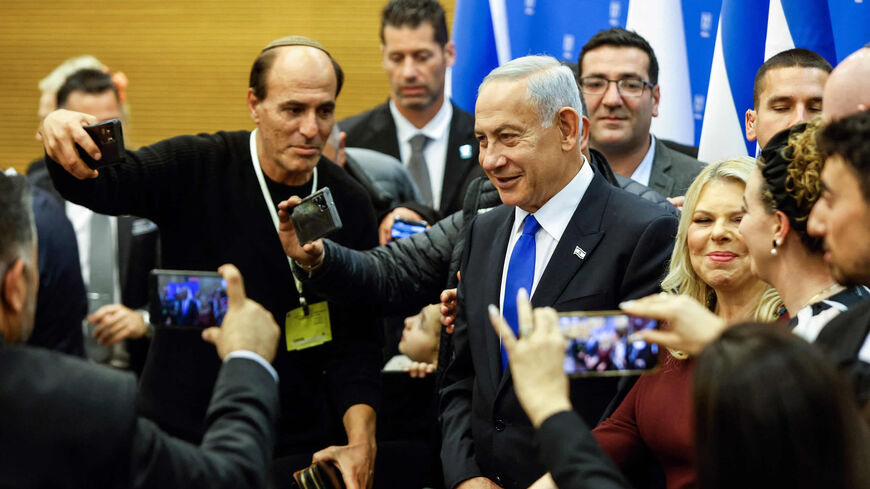 Israeli Prime Minister Benjamin Netanyahu and his wife Sara attend a toast for the new Knesset Speaker Amir Ohana (unseen) after the new government is sworn in at the parliament, Jerusalem, Dec. 29, 2022.