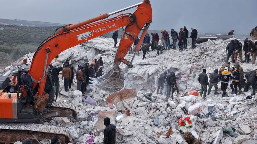 Residents and rescuers search for victims and survivors amidst the rubble of collapsed buildings.