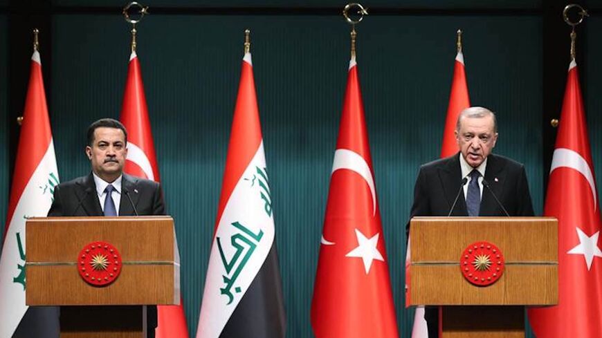 Turkish President Recep Tayyip Erdogan (R).