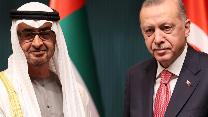 Turkish President Recep Tayyip Erdogan (R) and Abu Dhabi's Crown Prince Sheikh Mohammed bin Zayed Al Nahyan pose as they attend a signing ceremony regarding the agreements between the two countries at the Presidential Complex in Ankara, on November 24, 2021.  (Photo by ADEM ALTAN/AFP via Getty Images)