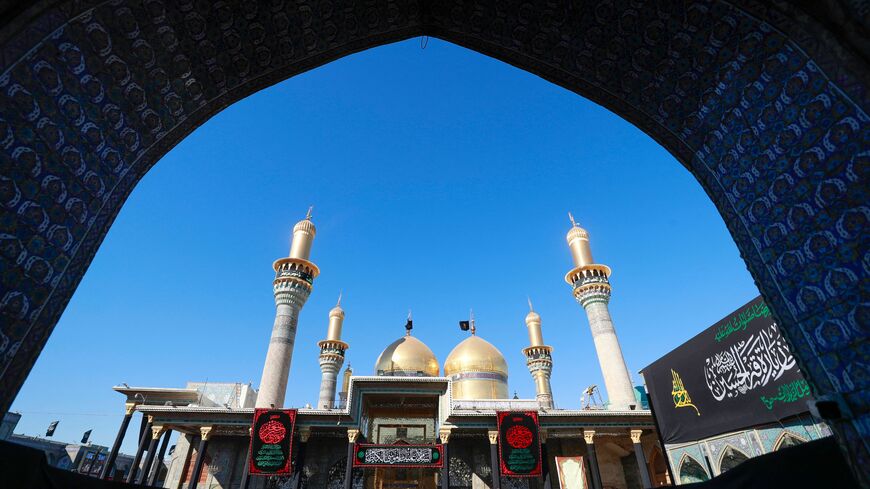 Shiite Muslim pilgrims gather to pray at the shrine of the 8th-century Imam Musa al-Kadhim in the Kadhimiya district, north of Baghdad, on February 17, 2023. (Photo by AHMAD AL-RUBAYE/AFP via Getty Images)