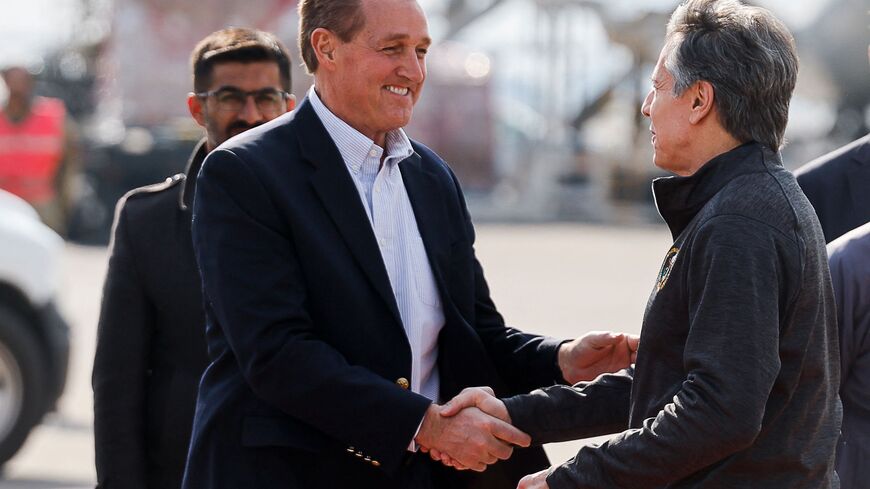 US Secretary of State Antony Blinken (R) is welcomed by US Ambassador to Turkey Jeff Flake as he arrives at Incirlik Air Base near Adana on February 19, 2023, for an official visit after a 7,8-magnitude earthquake struck Turkey's south-east. - The death toll on February 18 rose to more than 44,000 from the devastating earthquake in Turkey and Syria in the early hours of February 6, 2023. (Photo by CLODAGH KILCOYNE/POOL/AFP via Getty Images)