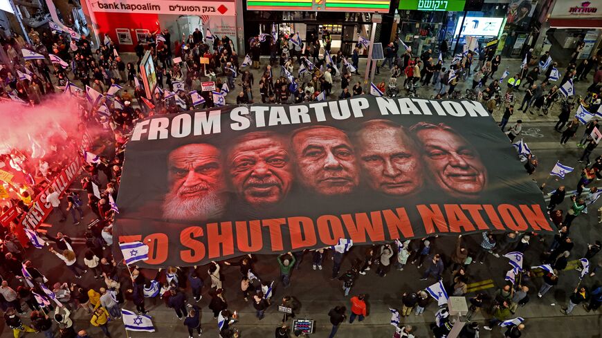  Israelis take part in ongoing protests against controversial legal reforms being touted by the country's hard-right government, in Tel Aviv on February 25, 2023.  (Photo by JACK GUEZ/AFP via Getty Images)