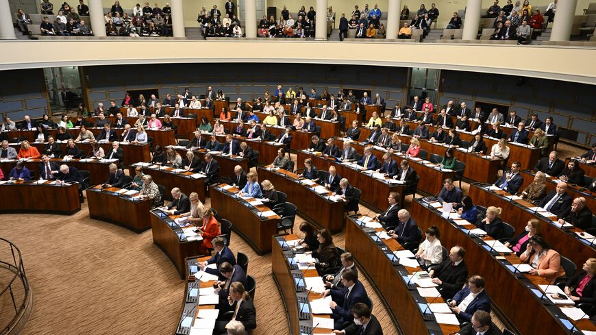 Finnish MPs attend a plenary session of the Finnish parliament on a vote on the country's entry to NATO in Helsinki, Finland on March 1, 2023. - Finland's parliament on March 1 voted overwhelmingly in favour of joining NATO, ahead of ratifications from Hungary and Turkey, increasing the likelihood it will enter the alliance before Nordic neighbour Sweden. Lawmakers approved a law affirming that Finland accepts the terms of the NATO treaty by 184 votes against seven. (Photo by Heikki Saukkomaa / Lehtikuva /