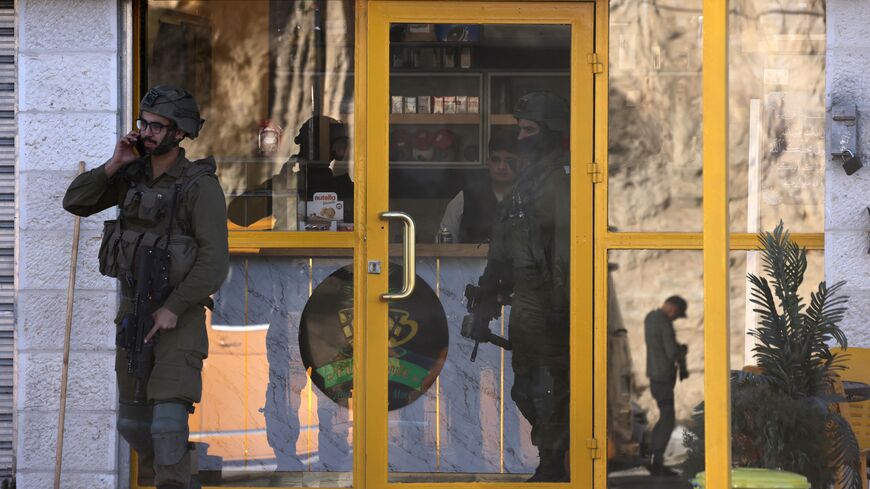 Israeli soldiers search for suspects during an operation near the Jit junction west of Nablus in the occupied northern West Bank on March 12, 2023. - Israeli forces shot dead three Palestinian gunmen after they fired at troops near Nablus, the army announced early in the moring. Palestinian medical and security sources had no information on the event. (Photo by jaafar ashtiyeh / AFP) (Photo by JAAFAR ASHTIYEH/AFP via Getty Images)