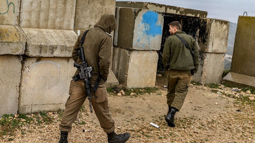 Israeli soldiers patrol the border with Lebanon near the northern village of Arab al-Aramshe after the army announced that a suspect killed inside Israel this week was wearing an explosive belt and believed to have crossed from Lebanon