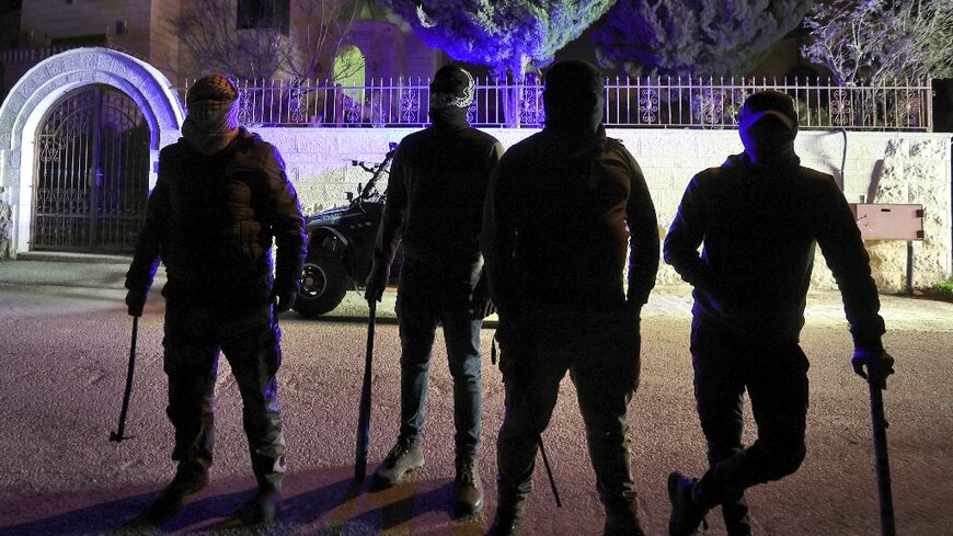 Armed only with sticks and flashlights, a group of young Palestinians mounts night patrols to guard their West Bank village against Israeli settlers following a spate of recent attacks