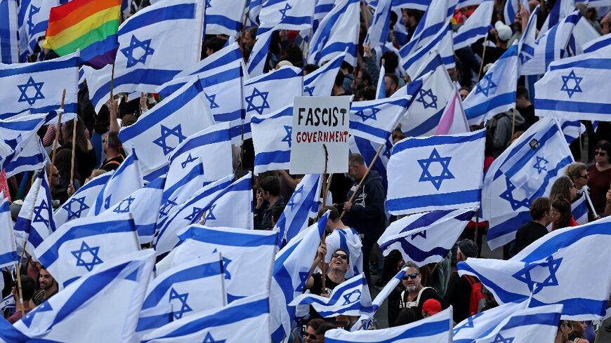 Protesters gather with national flags outside Israel's parliament in Jerusalem against the hard-right government's controversial push to overhaul the justice system