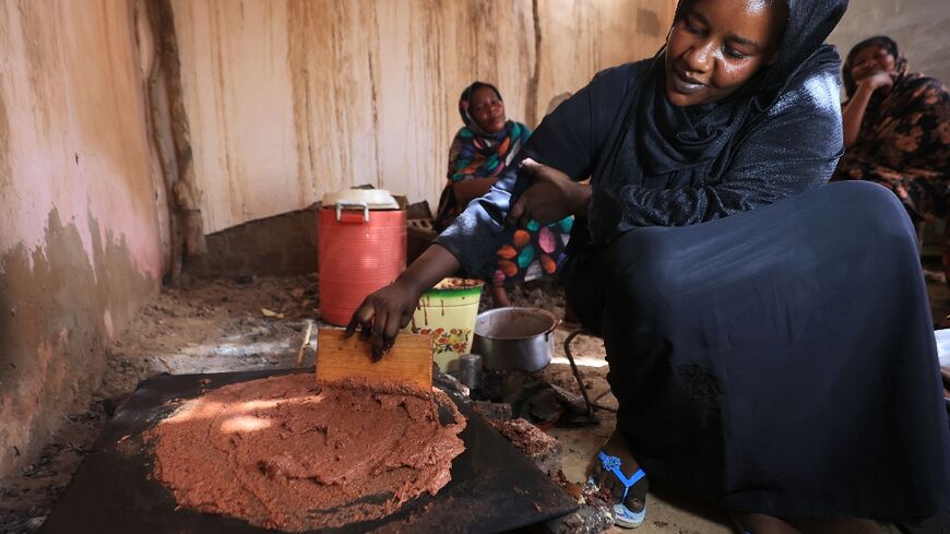 Sudanese women prepare 'helo-murr', a drink synonymous with the Islamic holy month of Ramadan