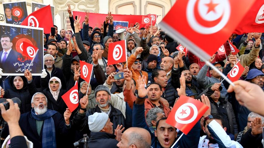 Waving their national flag, Tunisians demonstrate against their president and demand the release of detaines opposed to Kais Saied's rule