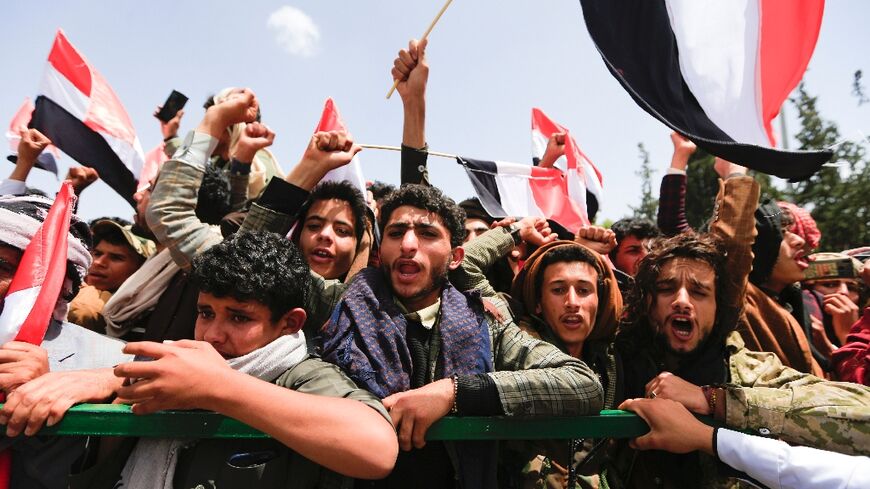 Yemenis await the arrival of freed prisoners at Sanaa airport