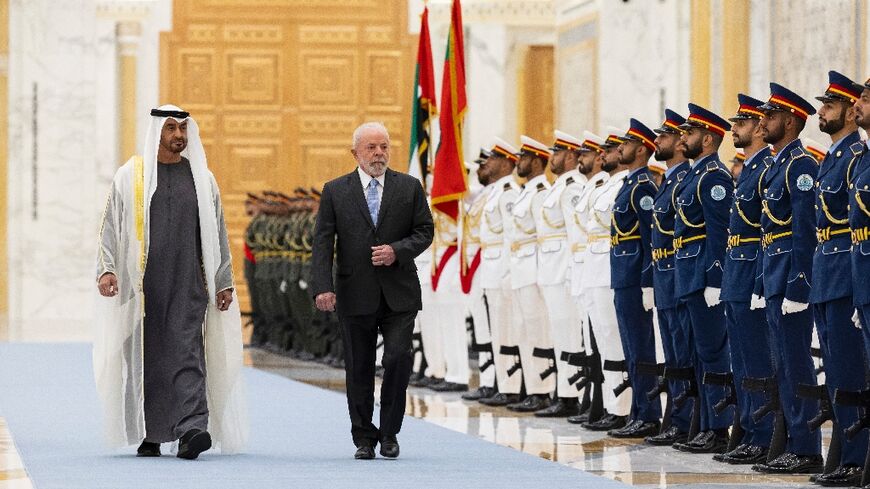 UAE President Sheikh Mohamed bin Zayed Al Nahyan and Brazil's President Luiz Inacio Lula da Silva inspecting the honour guard