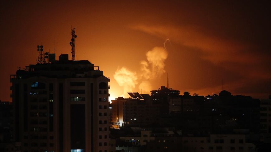 Smoke rises above buildings in Gaza City as Israel launches air strikes on the Palestinian enclave