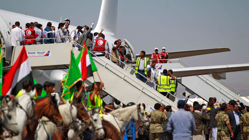 Freed Yemeni prisoners arrive in the rebel-held capital Sanaa, as the war-torn country began swapping 1,000 prisoners in a complex operation overseen by the International Committee of the Red Cross, Oct. 16, 2020.