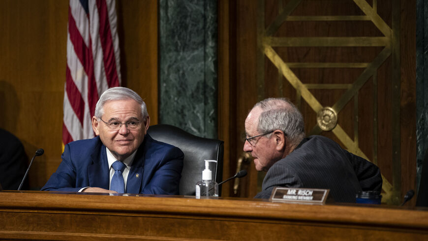 Chairman Sen. Robert Menendez (D-NJ) (L) speaks with Sen. Jim Risch (R-ID) during a Senate Foreign Relations Committee hearing on April 26, 2022 in Washington, DC. U.S. Secretary of State Antony Blinken and Defense Secretary Lloyd Austin on Monday committed a total of $713 million in foreign military financing for Ukraine and 15 allied and partner countries. (Photo by Al Drago-Pool/Getty Images)