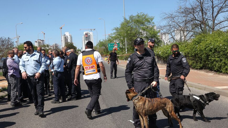 Israeli security forces inspect the scene of a stabbing attack near Tzrifin military base on the outskirts of Tel Aviv, on April 4, 2023. - Two soldiers were injured, and an alledged attacker arrested, following a stabbing attack in central Israel, police and medics said. (Photo by GIL COHEN-MAGEN / AFP) (Photo by GIL COHEN-MAGEN/AFP via Getty Images)