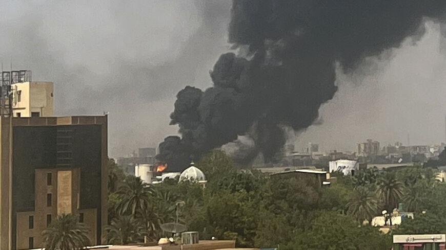 Smoke billows above residential buildings in Khartoum on April 16, 2023, as fighting in Sudan raged for a second week in battles between rival generals. (Photo by -/AFP via Getty Images)