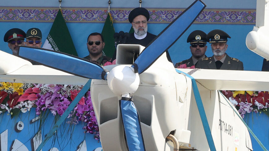 Iran's President Ebrahim Raisi watches combat drones alongside high-ranking officials and commanders during a military parade marking the country's annual army day in Tehran on April 18, 2023.