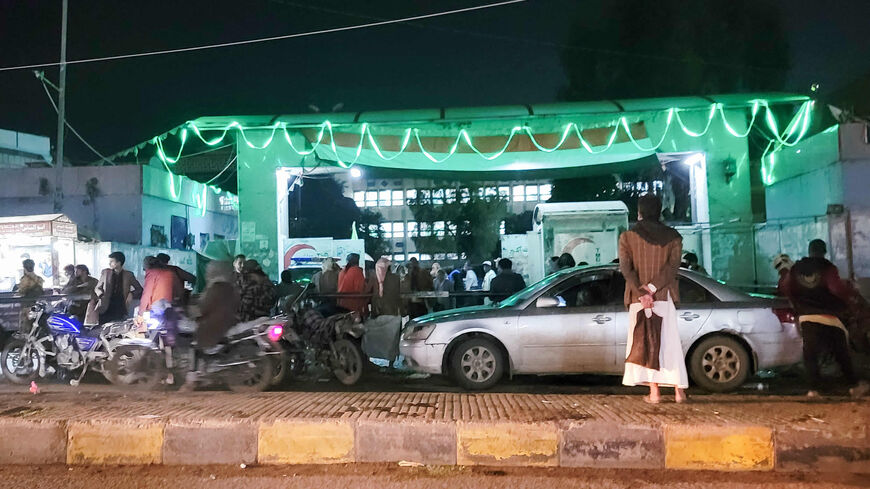 Yemenis wait outside a hospital after a stampede during charity distribution left at least 85 people dead and over 300 injured, Sanaa, Yemen, early April 20, 2023.