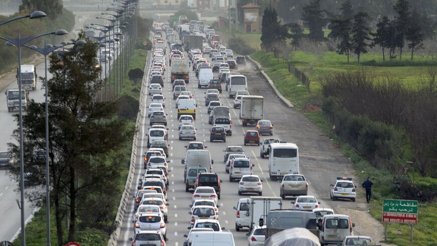 Cars drive on a road in the Algerian capital Algiers on February 1, 2017. / AFP / STRINGER (Photo credit should read STRINGER/AFP via Getty Images)