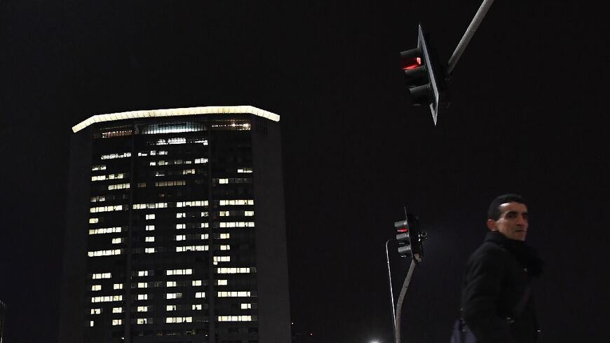 The windows of Milan's Pirelli tower are illuminated to commemorate World AIDS Day in December 2017