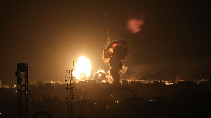 Smoke and flames rise above buildings after an Israeli airstrike in Rafah, southern Gaza Strip, on May 3