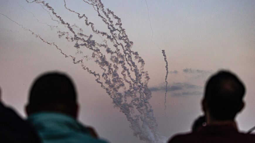 Rockets are fired from the southern Gaza City towards Israel on May 13, 2023. Israeli air strikes battered Gaza again on May 13 in response to rocket fire from militants as deadly fighting resumed after a night of relative calm, despite efforts to secure a truce. (Photo by SAID KHATIB / AFP) (Photo by SAID KHATIB/AFP via Getty Images)