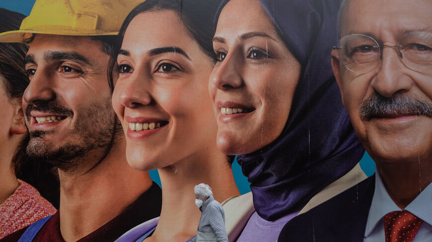 A woman walks past a poster showing the portrait of Kemal Kilicdaroglu, the presidential candidate of the Main Opposition alliance on May 05, 2023 in Istanbul, Turkey. On May 14th, Turkey’s President Erdogan will face his biggest electoral test as voters head to the polls in the country’s general election. Erdogan has been in power for more than two decades, as prime minister and then as president, but his popularity has taken a hit recently due to Turkey’s ongoing economic crisis and his government’s handl