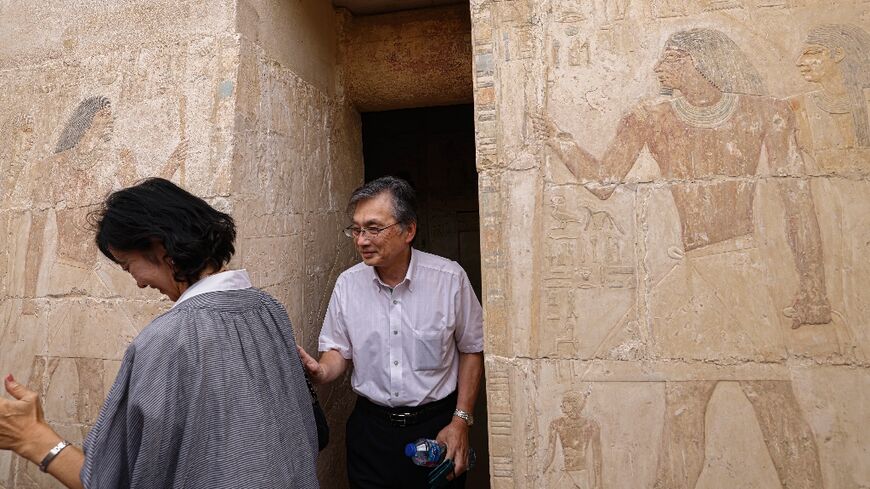 Japanese ambassador Oka Hiroshi visits a newly discovered tomb at the Saqqara archaeological site