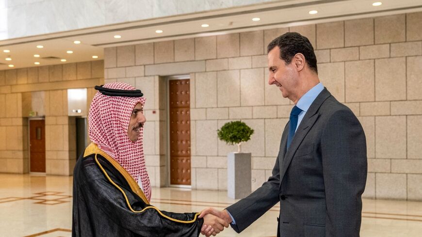 Syria's President Bashar al-Assad (R) received Saudi Arabia's Foreign Minister Faisal bin Farhan in Damascus last month