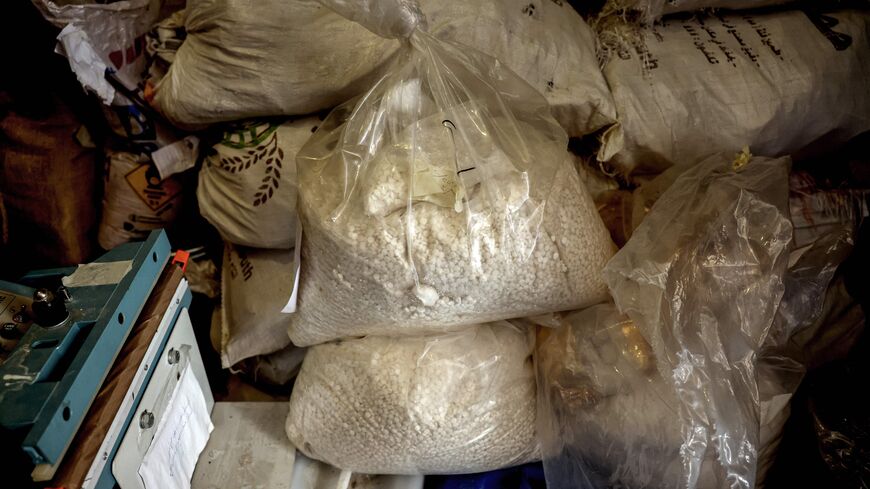 This picture taken on July 21, 2022 shows a view of sacks of confiscated captagon pills, presented at the judicial police headquarters in the city of Zahle in Lebanon's central Bekaa valley. - A decade of appalling civil war has left Syria fragmented and in ruins but one thing crosses every frontline: the drug fenethylline, commercially known as captagon. The stimulant -- once notorious for its association with Islamic State fighters -- has spawned an illegal $10-billion industry that not only props up the