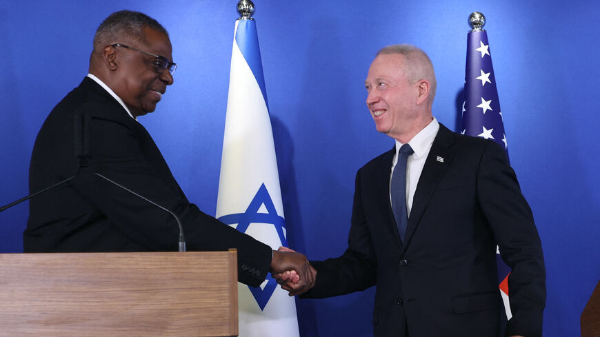 Israeli Minister of Defence Yoav Gallant (R) and US Secretary of Defense Lloyd Austin shake hands after delivering a statement to the press at the Israel Aerospace Industries (IAI) headquarters near the Ben Gurion airport in Tel Aviv, on March 9, 2023. 