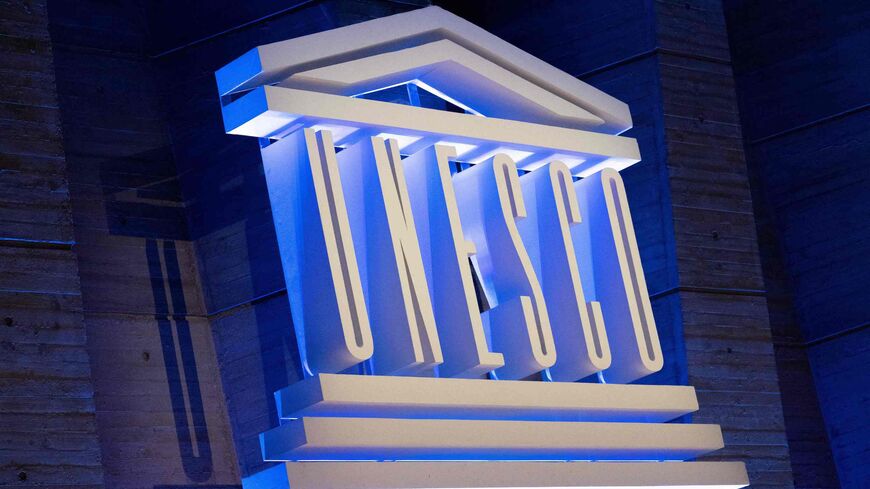 A photo shows the UNESCO logo during a speech by its director-general to announce the United States' request to return to the institution, at the UNESCO headquarters in Paris, on June 12, 2023. The United States plans to rejoin UNESCO from July this year, ending a lengthy dispute that saw Washington end its membership in 2018, the UN cultural agency announced on June 12. (Photo by ALAIN JOCARD / AFP) (Photo by ALAIN JOCARD/AFP via Getty Images)