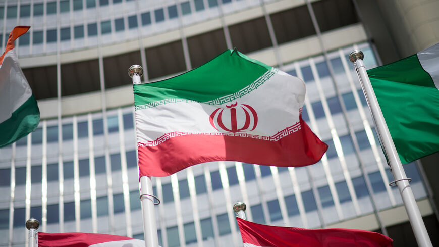 The flag of Iran is seen in front of the building of the International Atomic Energy Agency (IAEA) Headquarters ahead of a press conference by Rafael Grossi, Director General of the IAEA, about the agency's monitoring of Iran's nuclear energy program on May 24, 2021 in Vienna, Austria.  