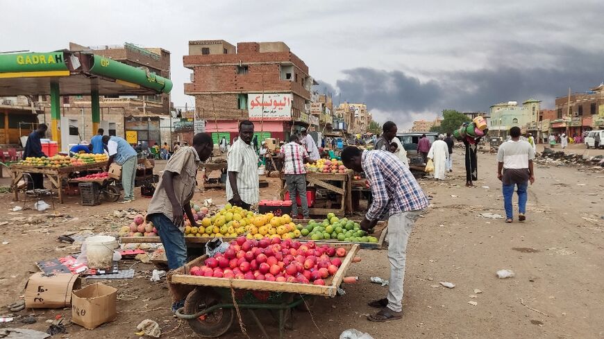 Khartoum residents take advantage of a lull in fighting in the first few hours of Saturday's truce to stock up on fruit and other basic goods that have been in short supply