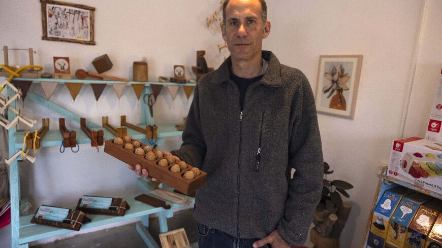 Standing in a former factory in Hanita, a kibbutz in Israel's north, Yuval Vakrat is surrounded by shops, an art gallery and a distillery